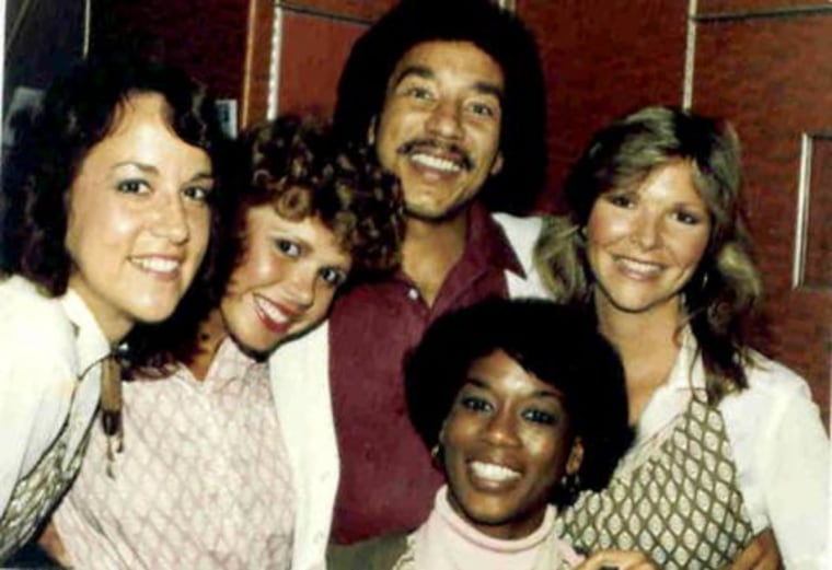 Casey Grant, shown here with Motown legend Smokey Robinson and fellow flight attendants Debbie Phillips, Sharon Hirtzer, Ellen Lucas, says meeting celebrities was a great perk of the job.