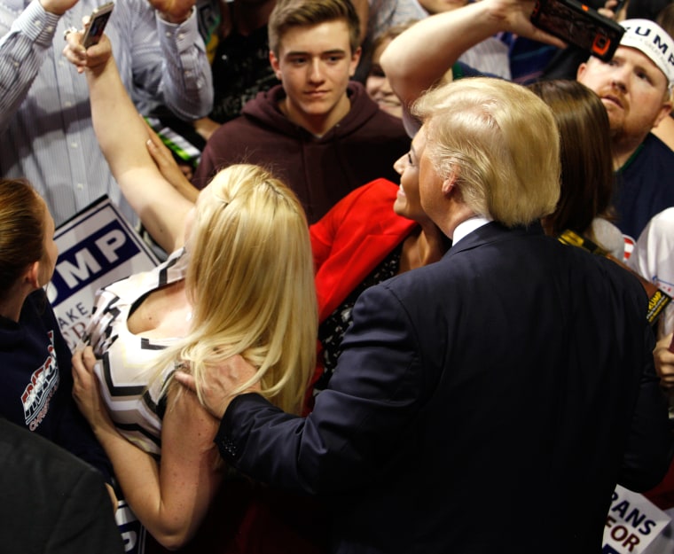 Image: U.S. Republican presidential candidate Donald Trump poses for a photograph with supporters at the end of a campaign rally in Fayetteville, North Carolina