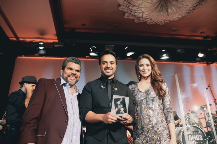 Actor Luis Guzmán, singer Luis Fonsi, and Miss USA Nia Sanchez.  Sanchez and Guzmán served as masters of ceremony for the Positive Impact Awards during the Hispanicize Event 2015.