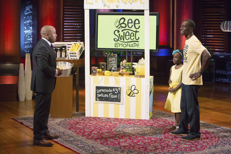 Mikaila Ulmer with her father on the TV show, "Shark Tank," where she secured $60,000 for her business.