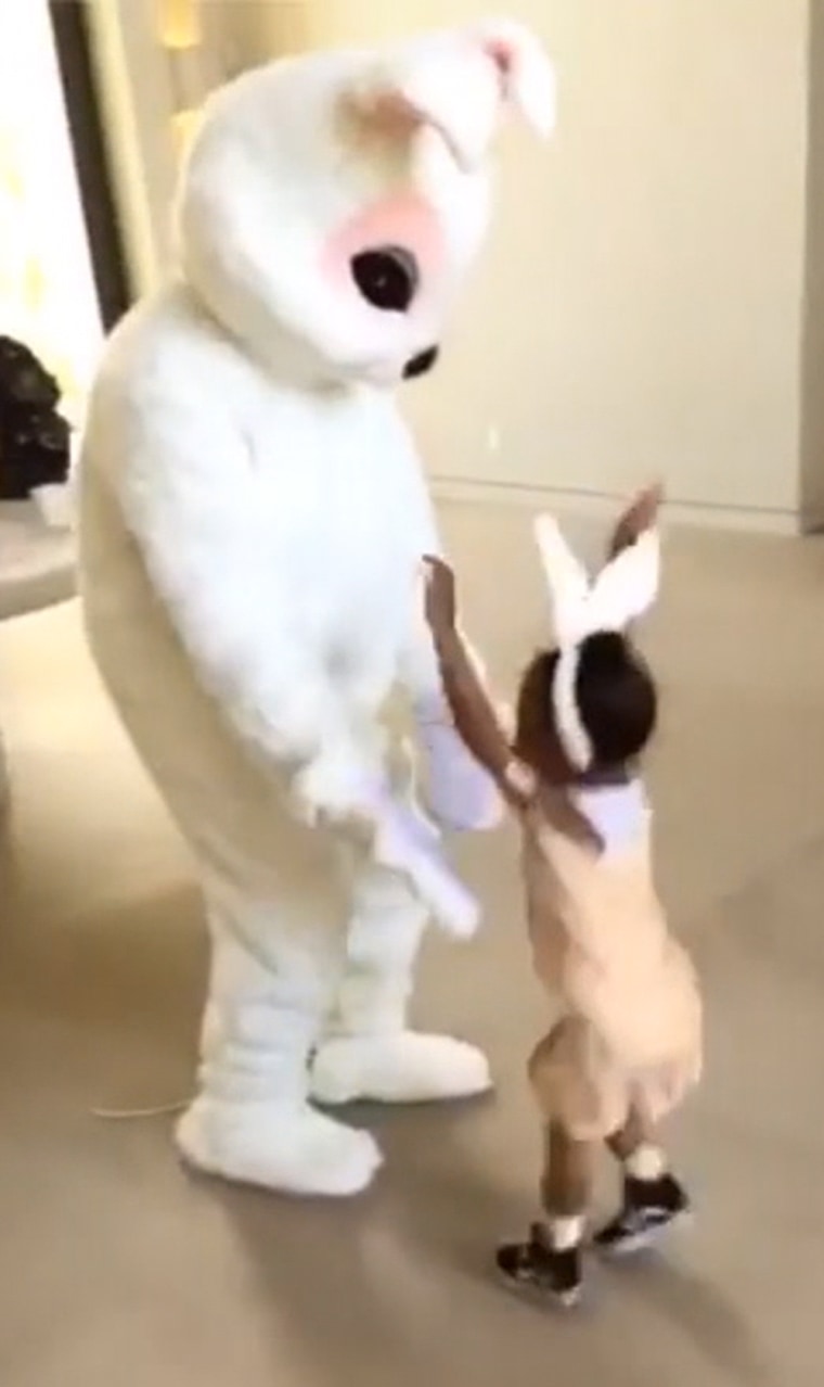 Kanye West dressed as the Easter Bunny with daughter North West on Easter