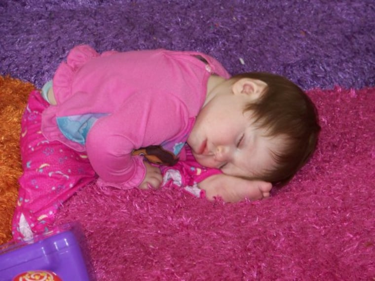 Jennifer Swartvagher's child sleeping in funny position