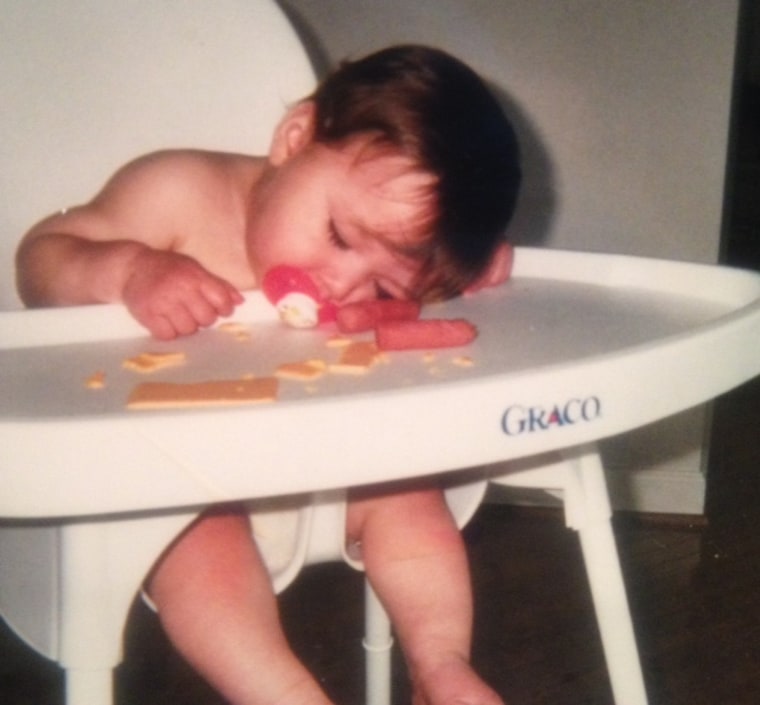 Sleeping child in high chair