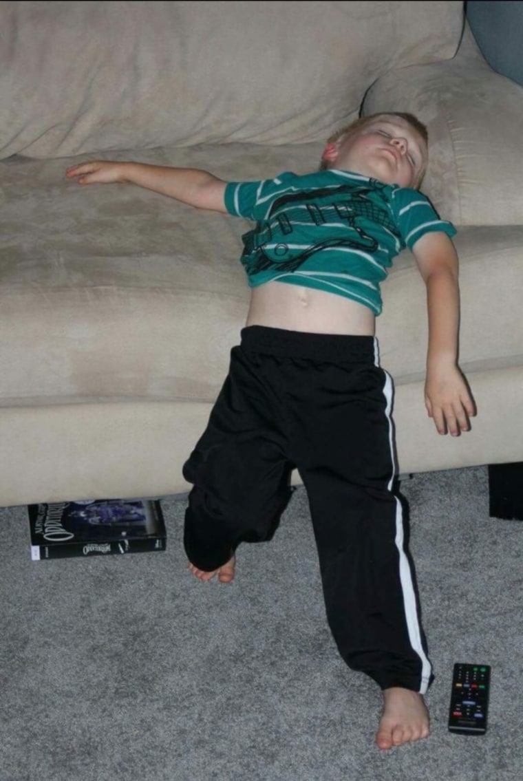 Boy sleeping while standing