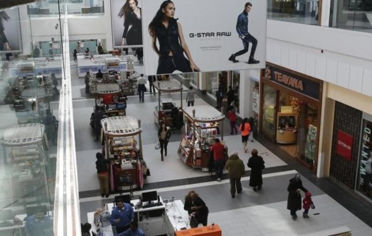 People are seen walking through Roosevelt Field shopping mall in Garden City, New York