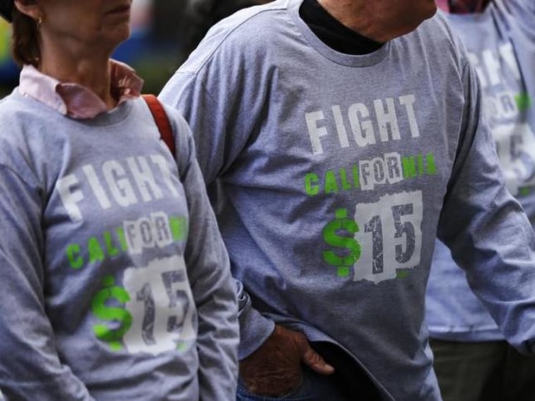 Protesters gather outside a Wendy's fast food restaurant in support of a nation-wide strike and protest to raise the hourly minimum wage of fast food workers in San Diego