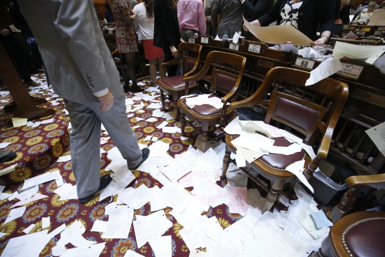 Paper litters the floor after the conclusion of the final day of the Georgia General Assembly at the capitol in Atlanta on Friday, March 25, 2016. (AP Photo/Jason Getz)