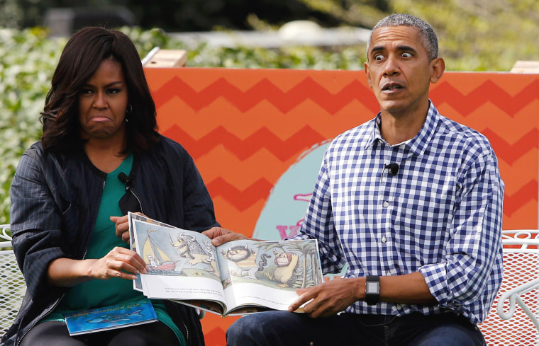 Image: First lady Michelle Obama and President Barack Obama perform a reading of the children's book \"Where the Wild Things Are\" at White House Easter Egg Roll at the White House in Washington