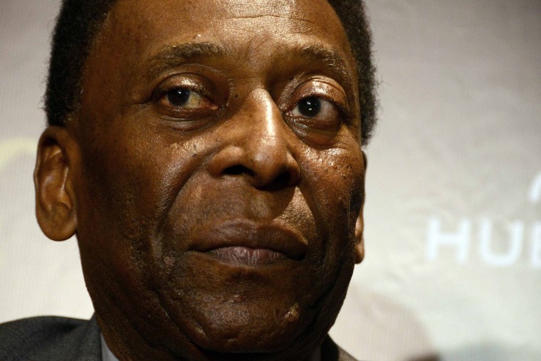 Image: Pele looks on during a news conference  in Rio de Janeiro