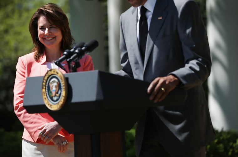 Shanna Peeples listens as U.S. President Barack Obama (R) speaks at a Rose Garden event to honor the 2015 National Teacher of the Year and finalists April 29, 2015 at the White House in Washington, DC. Peeples works at Palo Duro High School in Amarillo, Texas. 