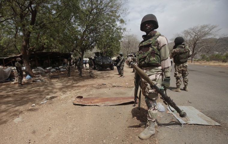 Nigerian soldiers man a checkpoint in Gwoza, Nigeria, in April 2015.