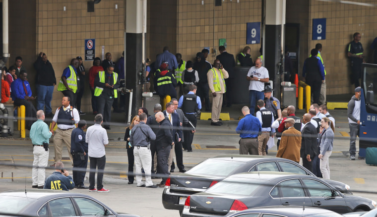 Image: Police and rescue officials gather outside the Greyhound Bus Station