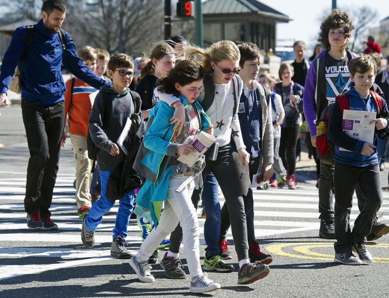 Image: Children are escorted away from the Capitol after reports of gunfire at the Capitol
