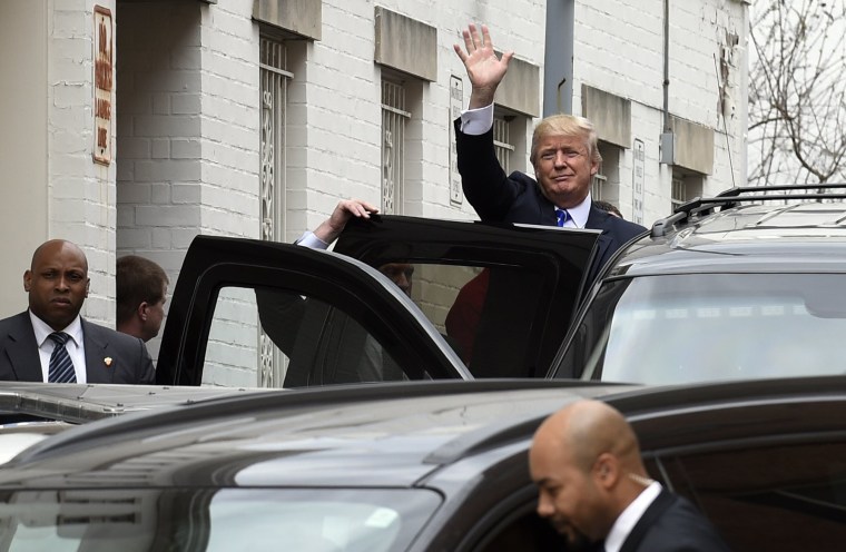 Image: Trump waves as he gets into his vehicle in Washington