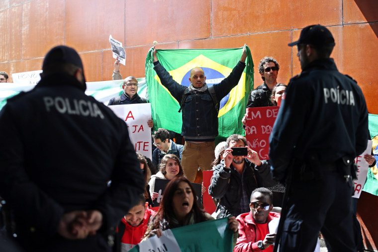 Image: Supporters of President Dilma Rousseff protest outside the Lisbon University