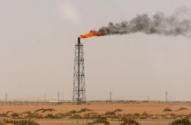 A gas flame is seen in the desert near the Khurais oilfield