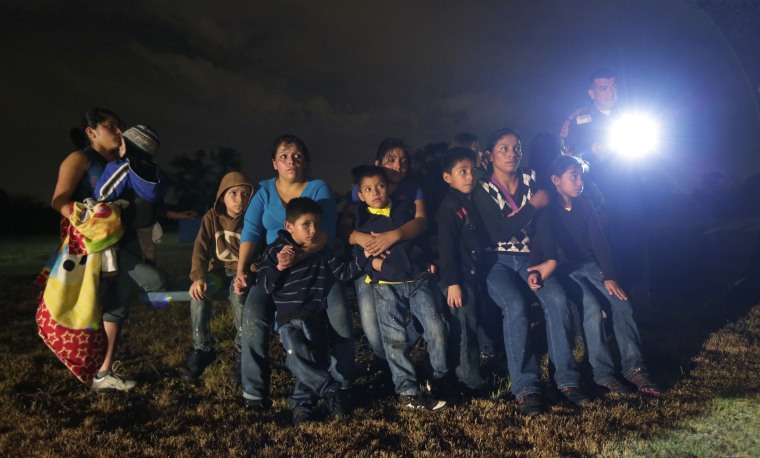 A group of immigrants from Honduras and El Salvador who crossed the U.S.-Mexico border illegally are stopped in Granjeno, Texas on June 25, 2014. The epicenter of the 2014 surge in illegal immigration is a 5-mile slice of deep South Texas that has become a hot spot for migrants, human smugglers and drug cartels.