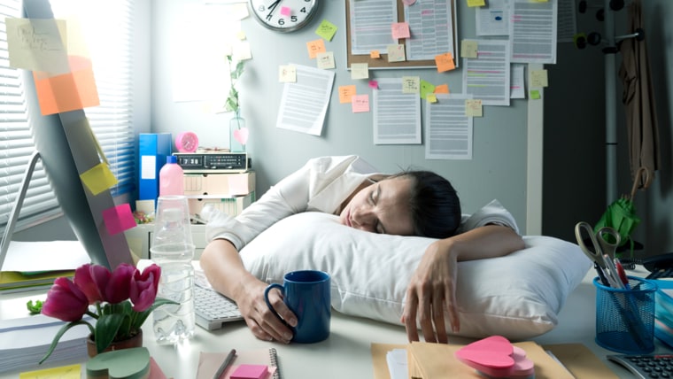 woman-sleeping-desk-today-160406