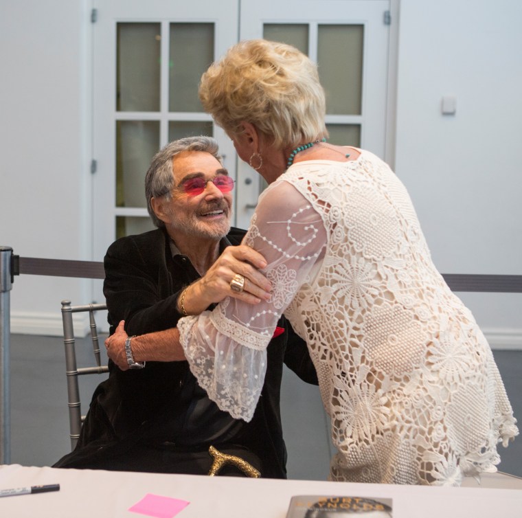 Burt Reynolds and Ann Lawlor Scurry, who were high-school sweethearts, reunite at the Palm Beach Book Festival on April 2, 2016.