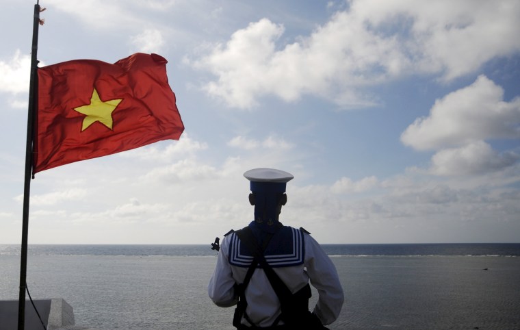 Image: File photo of a Vietnamese naval soldier standing quard at Thuyen Chai island in the Spratly archipelago