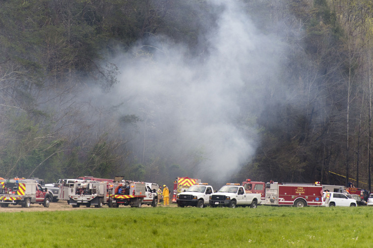 Image: Emergency vehicles respond to the scene of a fatal helicopter crash
