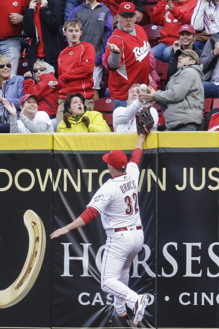 Image: Cincinnati Reds right fielder Jay Bruce reaches for but misses a two-run home run
