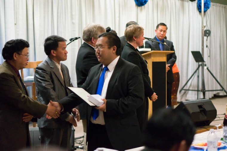 Yee Leng Xiong at a Hmong community leader congratulation party in Wausau, Wisconsin.