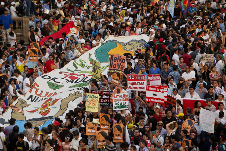 Image: Demonstrators take part in a protest against presidential candidate Keiko Fujimori