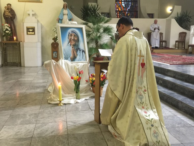 Image: A local priest in Skopje paying tribute to Mother Teresa.