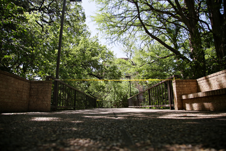 Image: Police tape blocks off an area in Waller Creek on the University of Texas campus in Austin