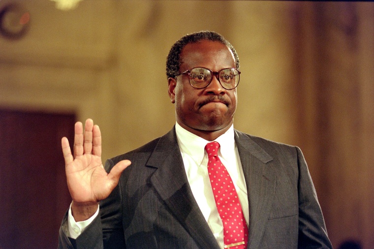 US Supreme Court nominee Clarence Thomas raises his right hand as he is sworn in, 10 September 1991, during confirmation hearings before the US Senate Judiciary Committee, in Washington D.C. U.S. law professor Anita Hill filed sexual harassment charges against US Supreme Court nominee Clarence Thomas.