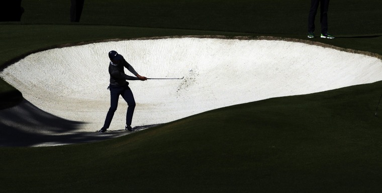 Image: Charl Schwartzel, of South Africa, hits out of a bunker