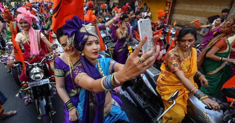 Image: Indian people in traditional clothes participate in the procession to celebrate the Gudi Padwa