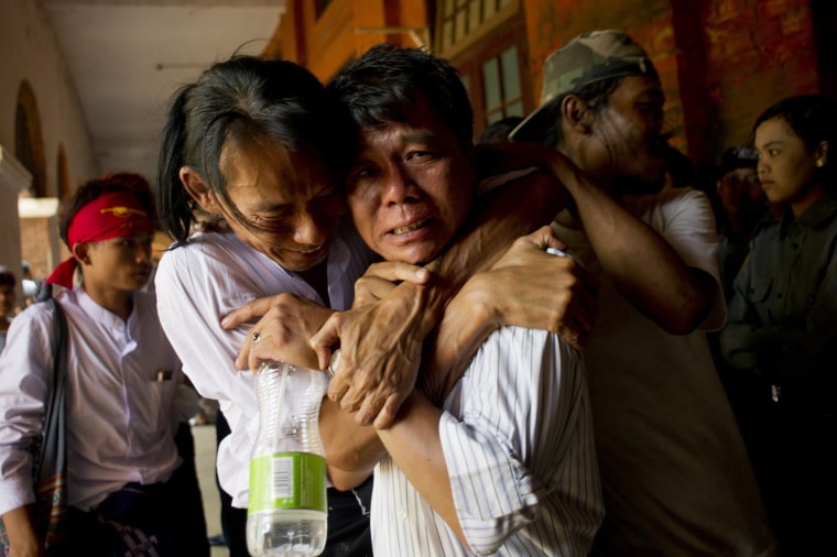 Image: Newly-released political student protester and family members cry after being reunited