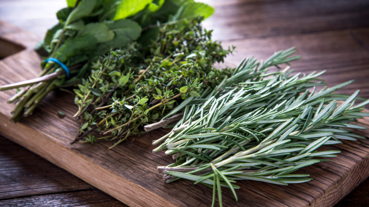 garden fresh herbs on wooden board