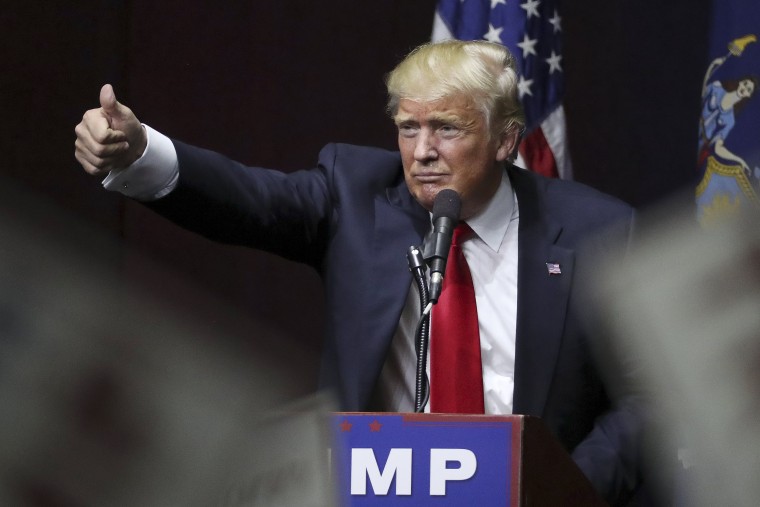 Image: U.S. Republican presidential candidate Donald Trump speaks on stage during campaign event at Grumman Studios in Bethpage, New York