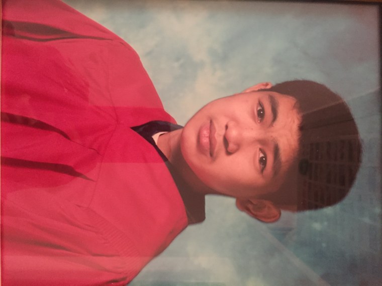 Yong Xin Huang graduating from middle school several months before being killed.