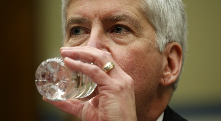 Image: Michigan Governor Rick Snyder drinks some water as he testifies for Flint Michigan water hearing on Capitol in Washington