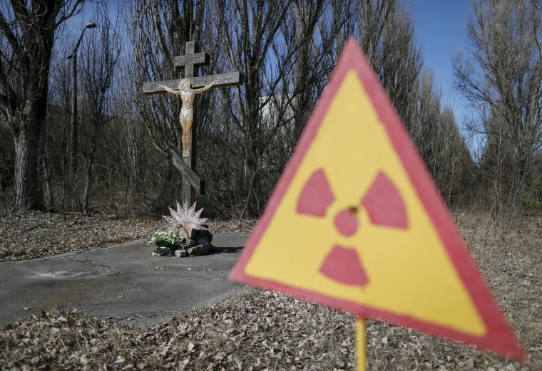 Image: A cross with a crucifix is seen in the deserted town of Pripyat near Chernobyl Nuclear Power Plant in Ukraine
