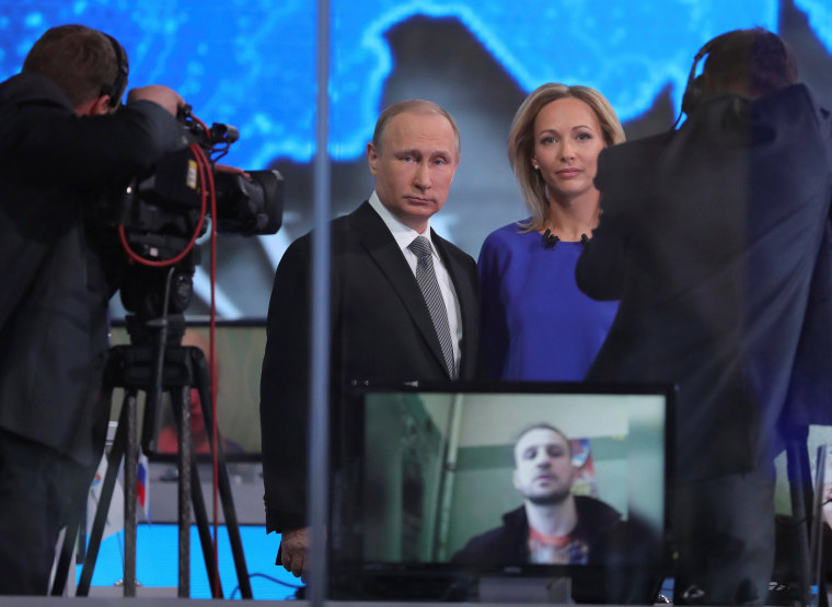 Image: Russian President Putin talks to journalists