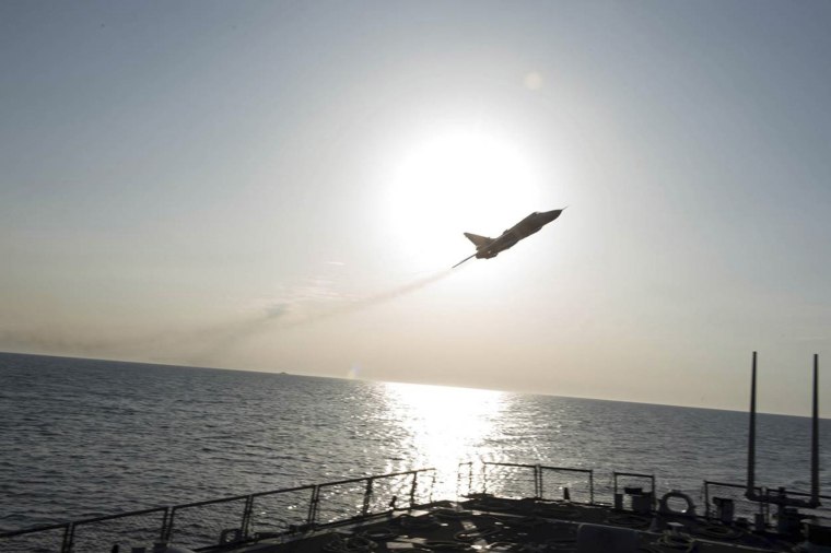Image: An U.S. Navy picture shows what appears to be a Russian Sukhoi SU-24 attack aircraft flying over the U.S. guided missile destroyer USS Donald Cook in the Baltic Sea