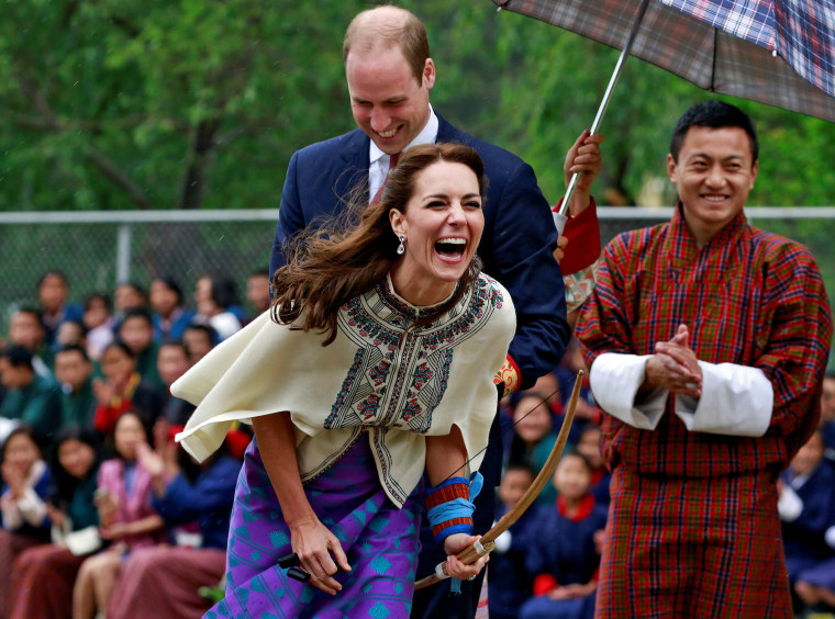 Image: Britain's Catherine, Duchess of Cambridge reacts after shooting an arrow at Changlimithang Archery Ground in Thimphu