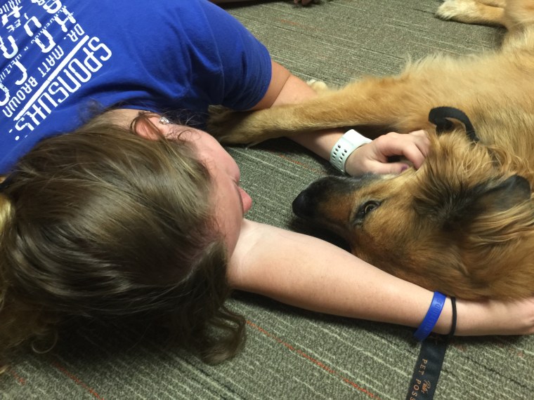 Amanda Slife and Charlie during a pet therapy sessions at the OSU ReBoot Center.