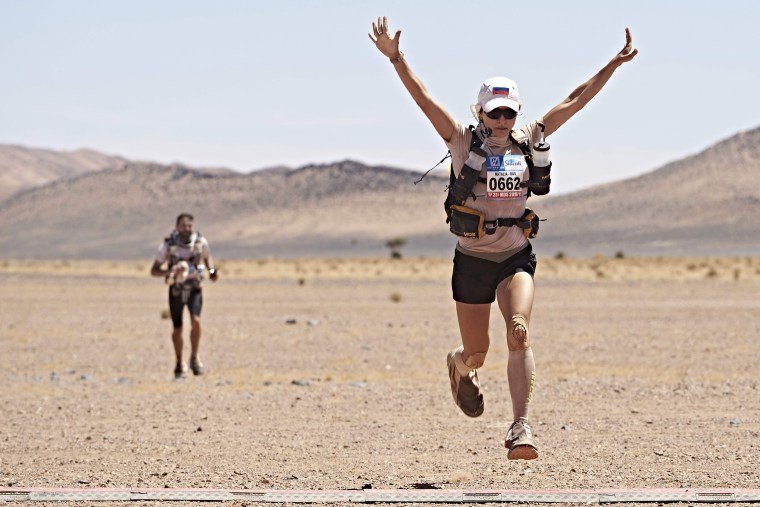 Image: Russian Natalia Sedykh celebrates after crossing the finish line