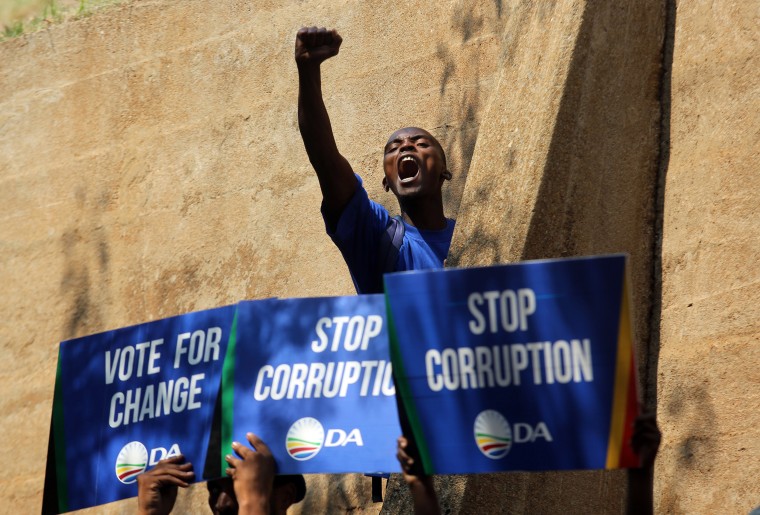 Image: A demonstrator voices his support after a protest march to the Constitutional Court in Johannesburg