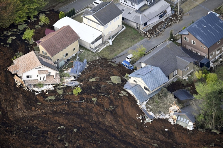 Image: Houses are buried in landslide caused by an earthquake