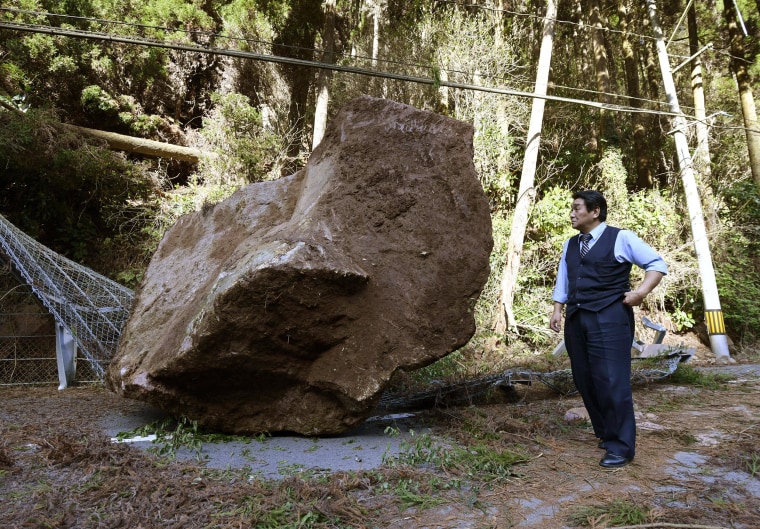 Image: A big rock covers a road following the earthquake