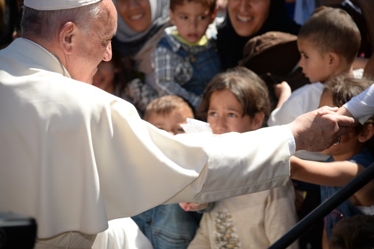 Image: Pope Francis greets migrants and refugees at the Moria refugee camp on Saturday.