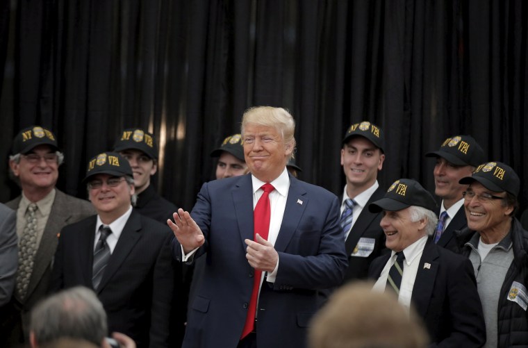 Image: U.S. Republican presidential candidate Donald Trump poses after receiving an endorsement from the New York Veteran Police Association in the borough of Staten Island in New York