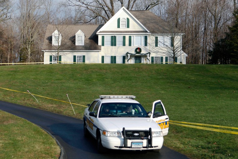 Image: A police cruiser sits in the driveway of the home of Nancy Lanza